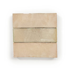 A beige tile with three strips of tan on it.