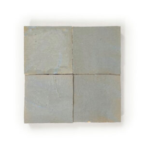 A square tile with four squares on it.
