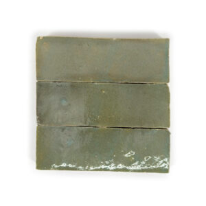 A green tile with three different colors of tiles