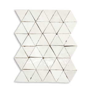 A white tile with triangles on it