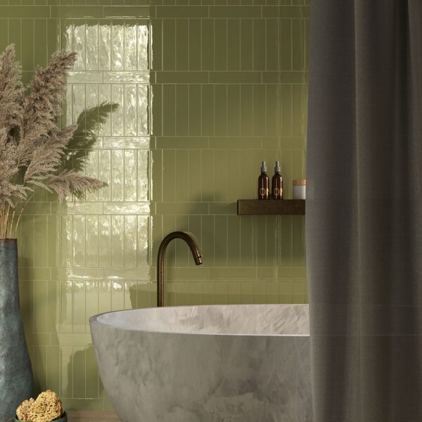 A bathroom with a tub, sink and shower.