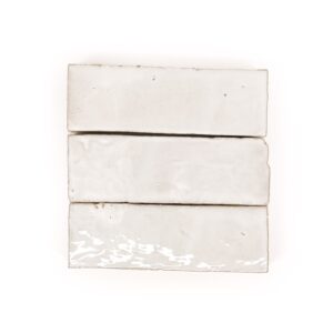 A white tile with three strips of tiles on it.