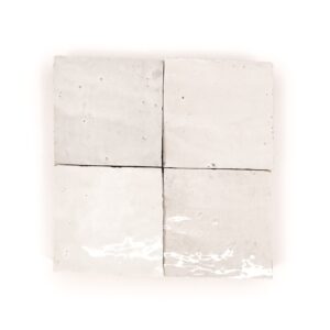 A white tile with four squares of different sizes.