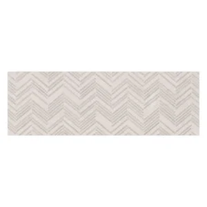 Chevron pattern on rectangular white tile.