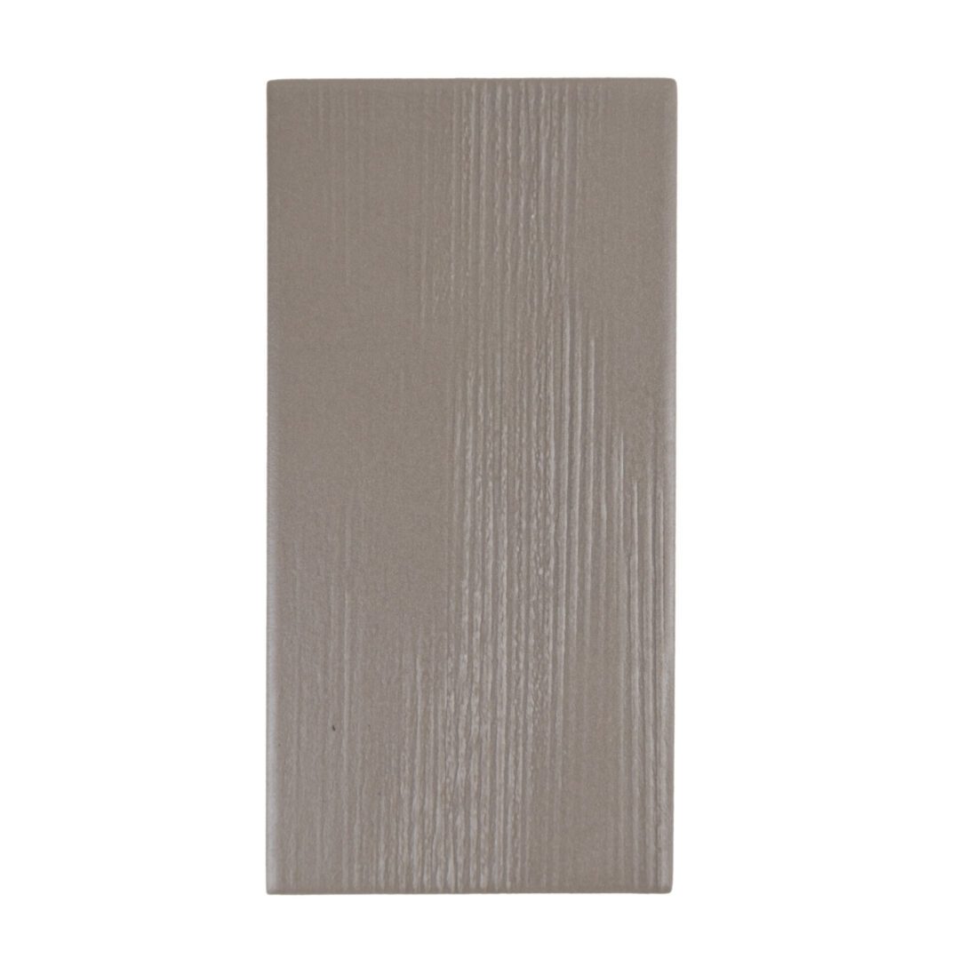 Gray textured rectangular tile with subtle pattern. Gray textured rectangular tile with subtle pattern.
